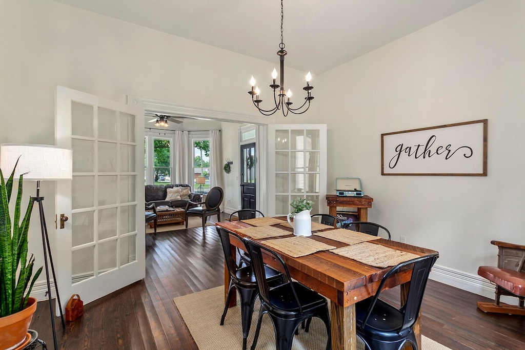 The historic home's original French doors open into the dining room, complete with table for six.