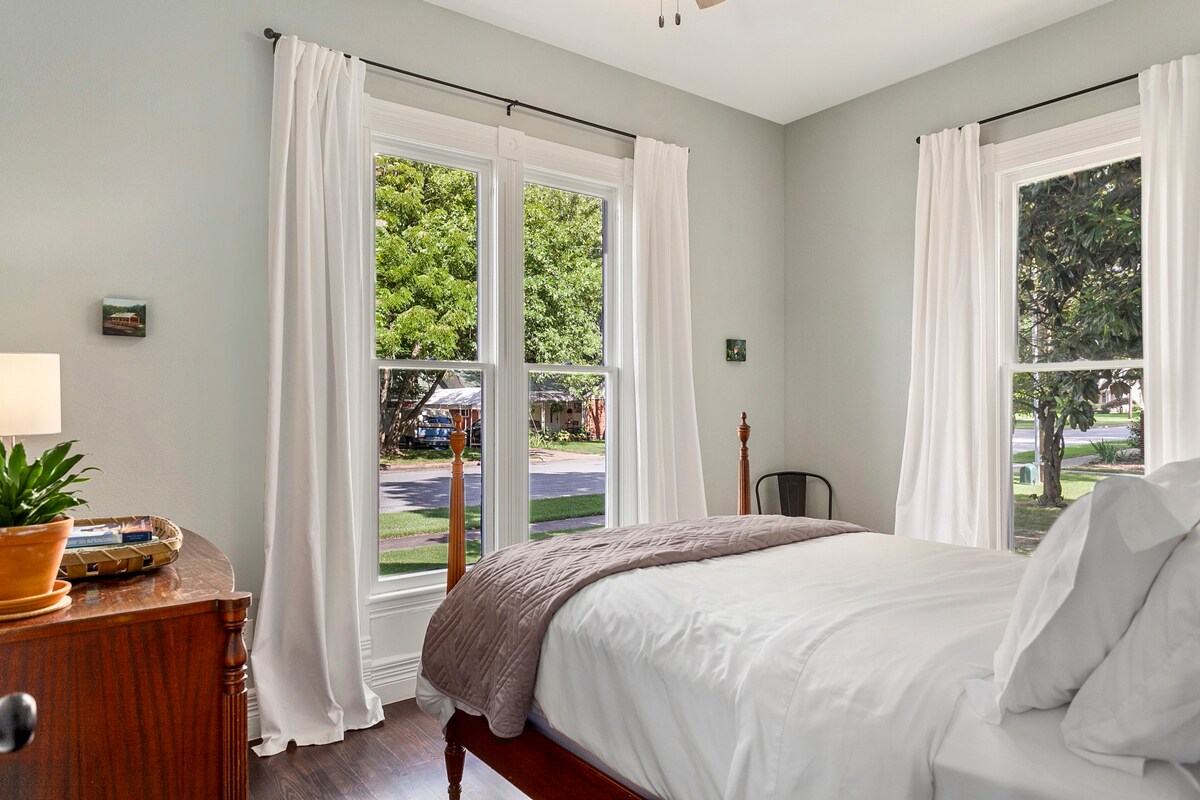 Gorgeous views of our yard's old growth shade trees make this bedroom a guest favorite.