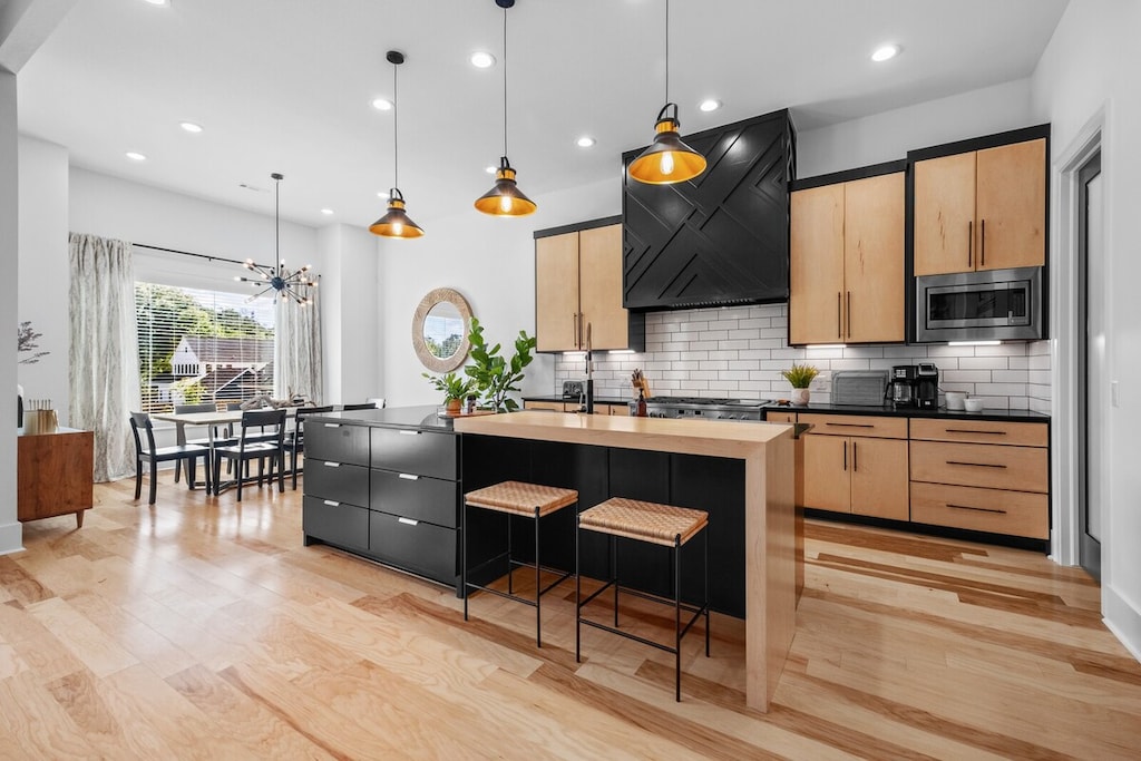 Huge fully stocked kitchen perfect for entertaining and complete with prep space and Sub-zero fridge.
