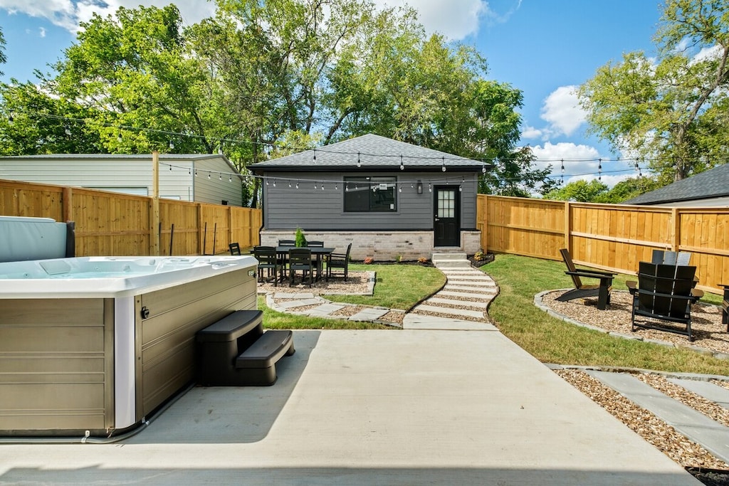 Our backyard is second to none. Equipped with a hot tub spa, Solo Stove fire pit, gas-powered grill, outdoor dining, and string lights. Plenty of space to entertain your crew!