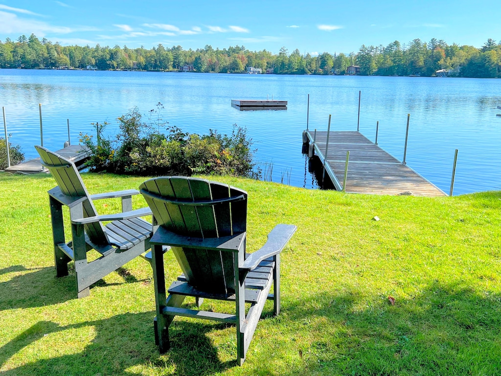 Waterfront area offers seating, a screened porch, dock, swim platform and several different boating options!