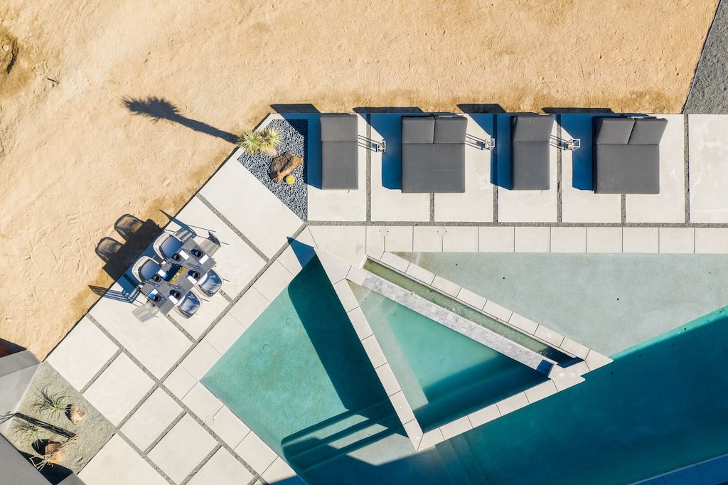 Swim or lounge in the custom multilevel pool and relax on one of the many plush outdoor couches and lounge chairs