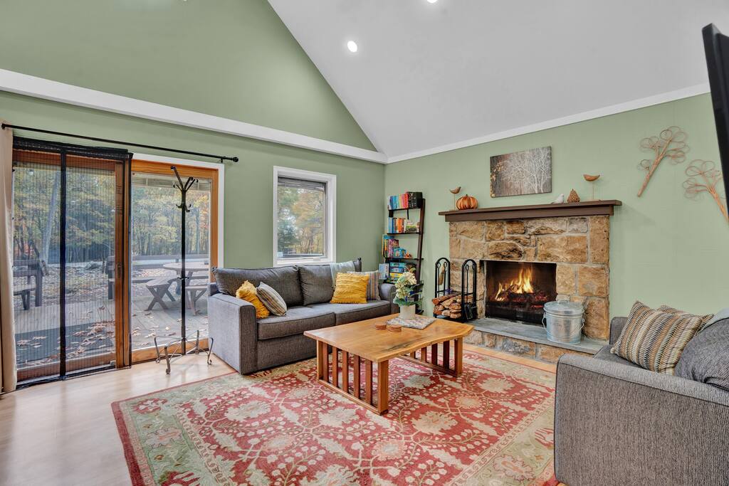 Wood burning fireplace is great for your winter retreat! Sofas are comfortable for watching TV on our 42-in smart TV (adjustable angle) or choose a board game, puzzle, or book from our collection. Large sofa also pulls out into a queen bed.