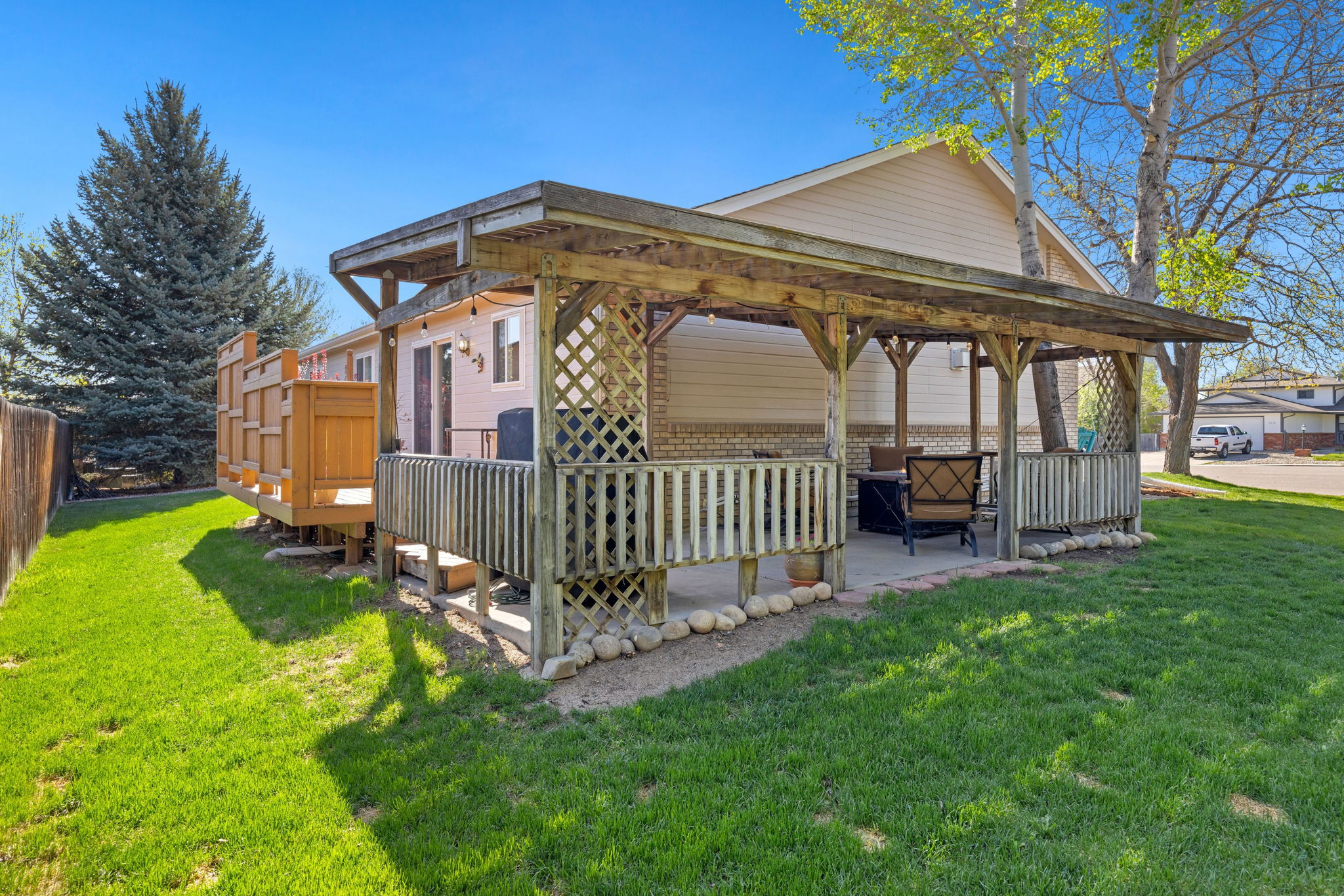 Backyard and Covered Patio | Shaded Seating Area and Fire Table