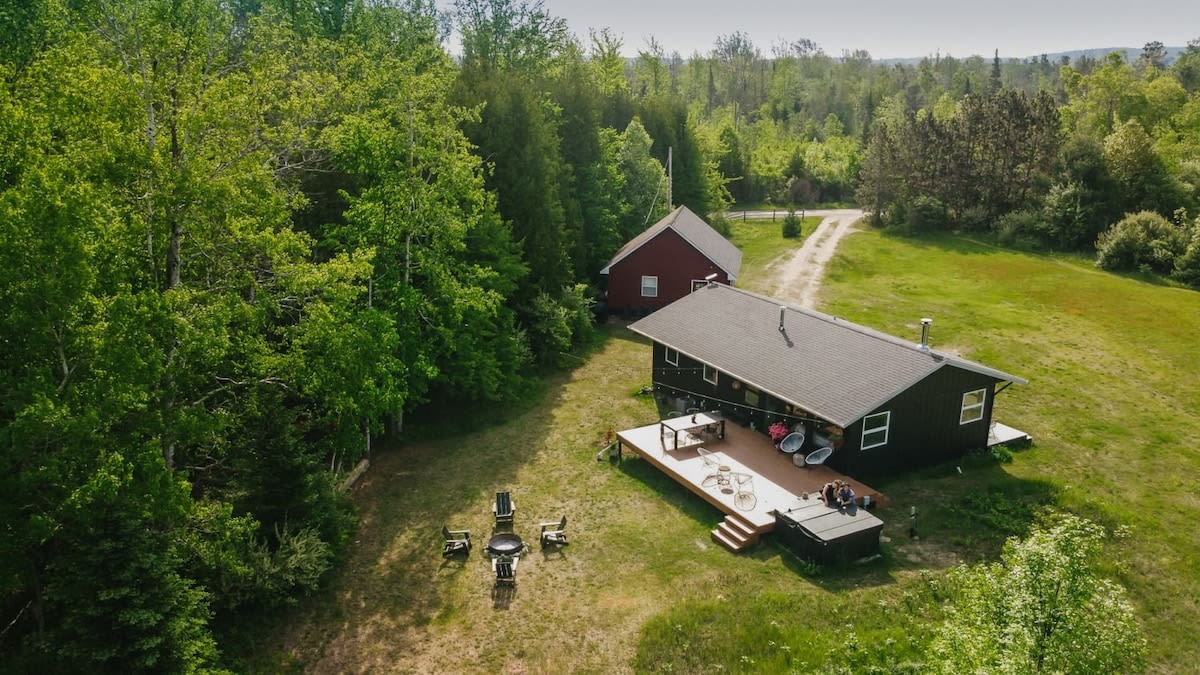 Nestled in a private  8 acre lot surrounded by forest