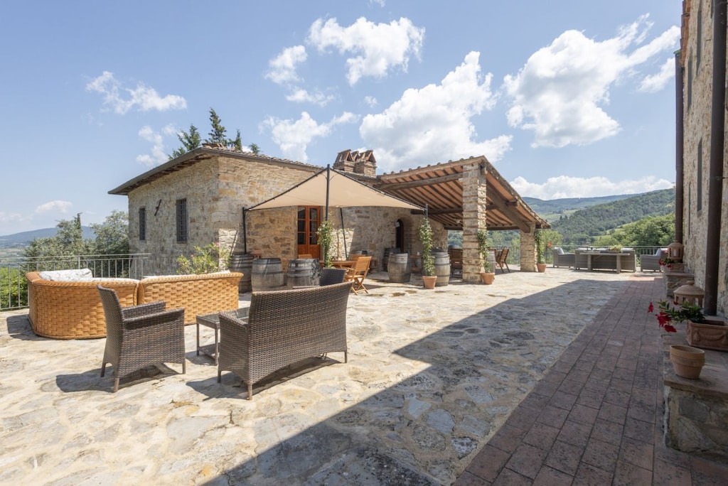 Outdoor Area: Dine under the Tuscan sky in the outdoor kitchen, equipped with tables, chairs, and everything needed for an unforgettable alfresco dining experience.