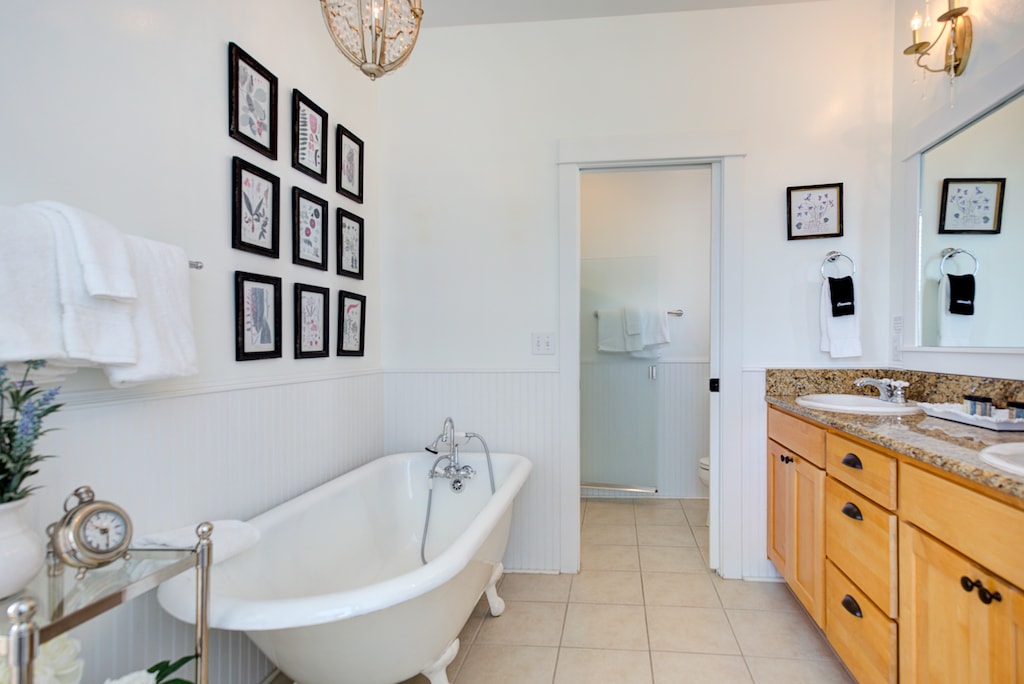 The ensuite bathroom offers a spa-like retreat