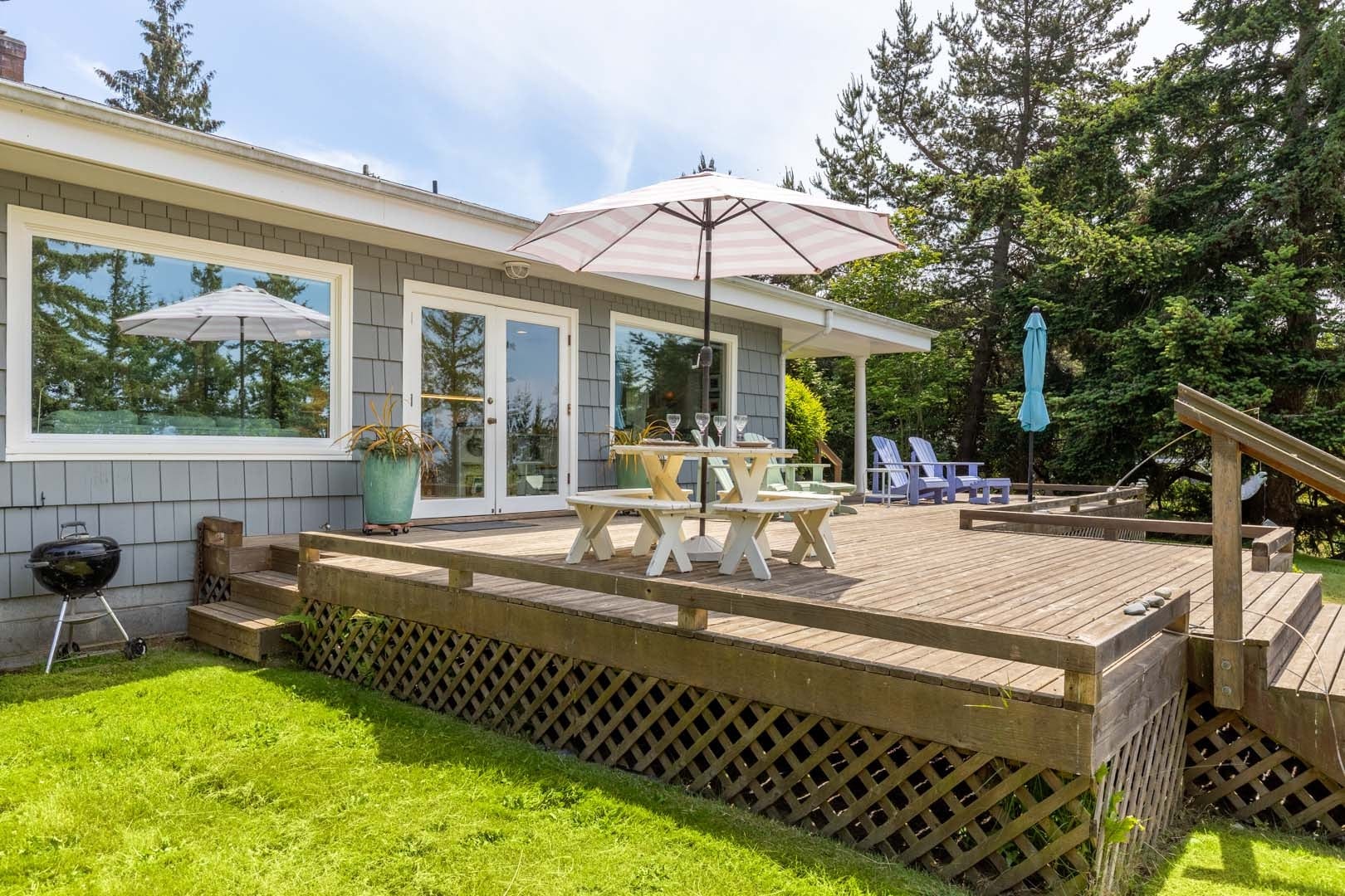 Expansive deck, dining, and seating for sun-soaked relaxation