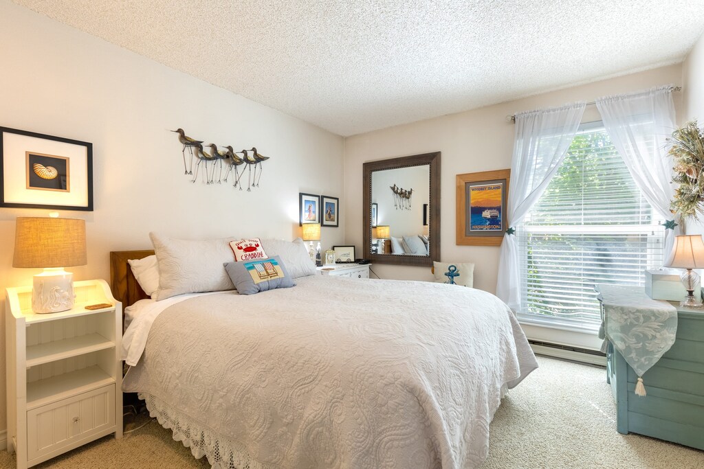 Bedroom 2 features a queen bed.