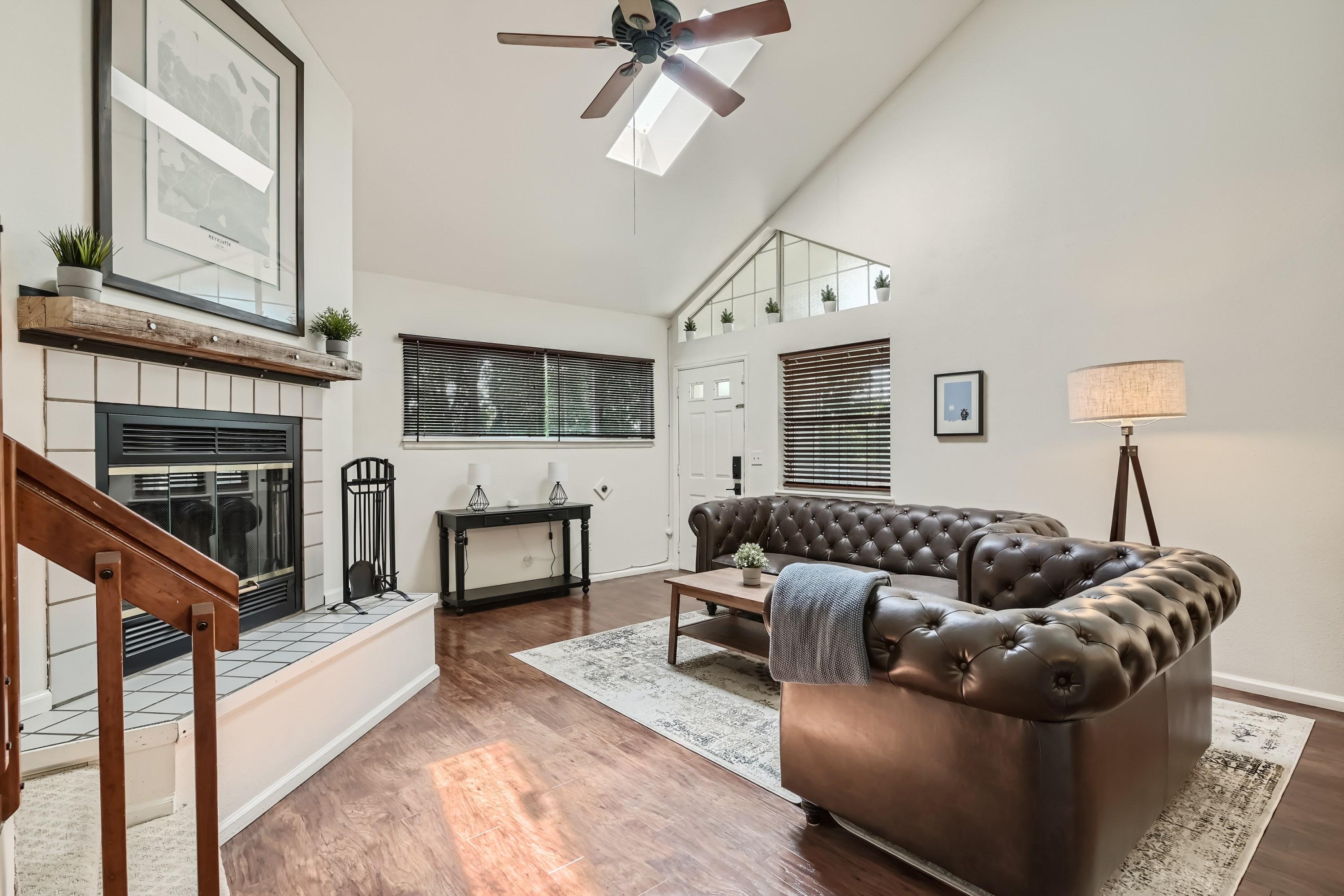 Living Room - Fireplace, Skylight, and Ceiling Fan