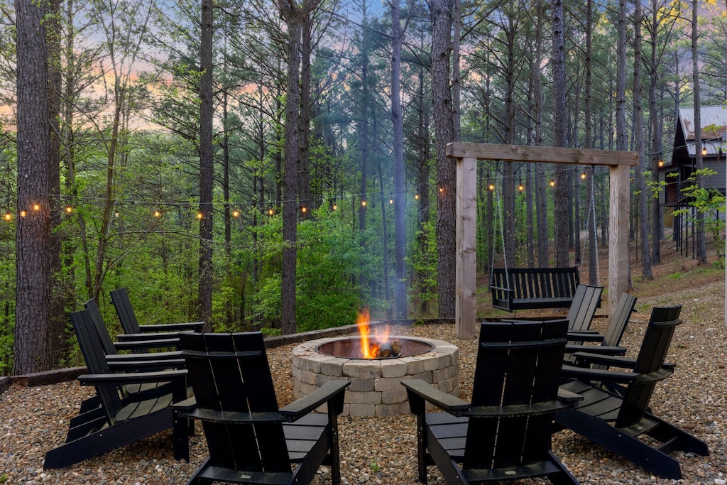 Fire pit with firewood provided. Swings near fire pit for additional seating!