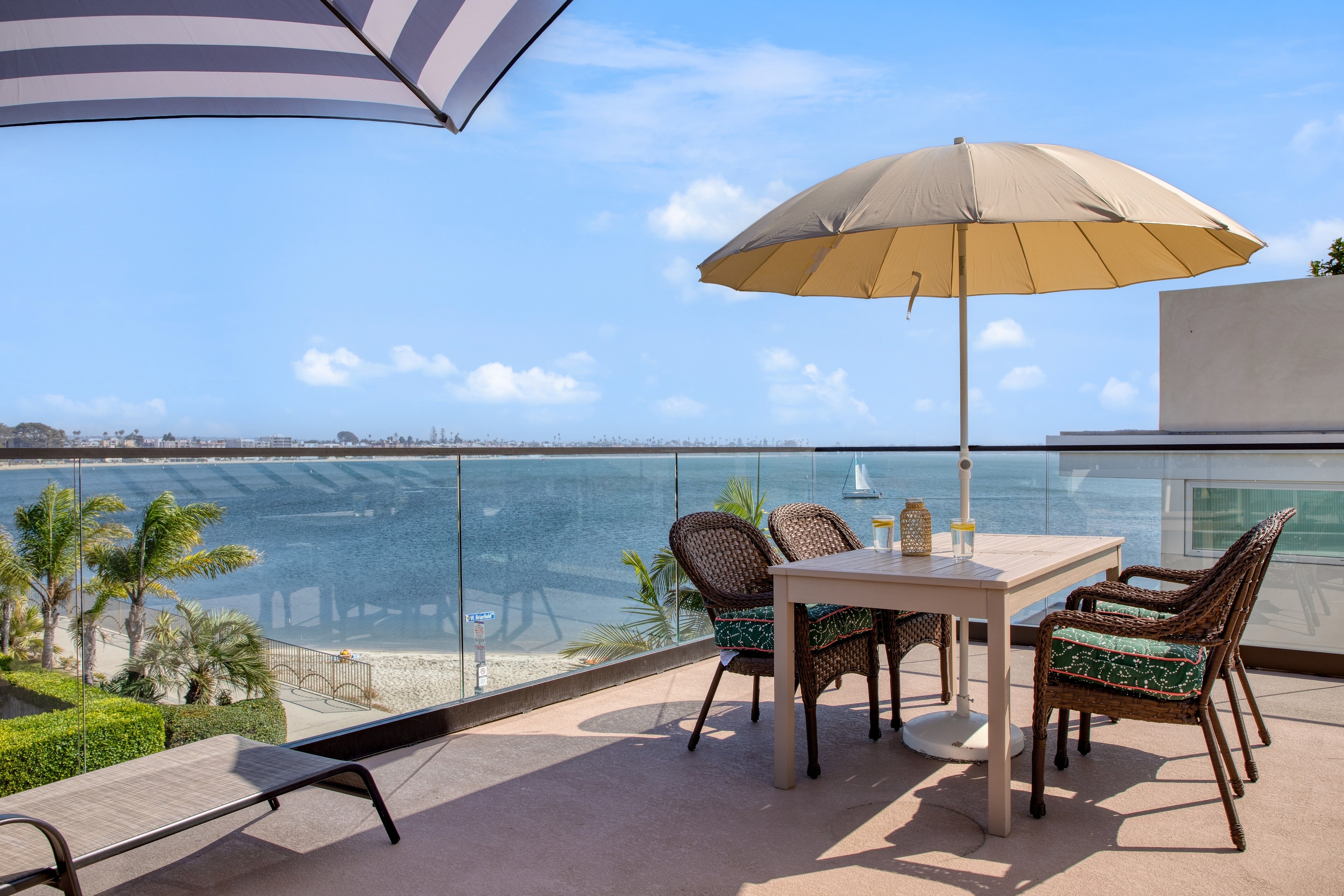 Sunny rooftop terrace with al fresco dining and incredible views of Sail Bay.