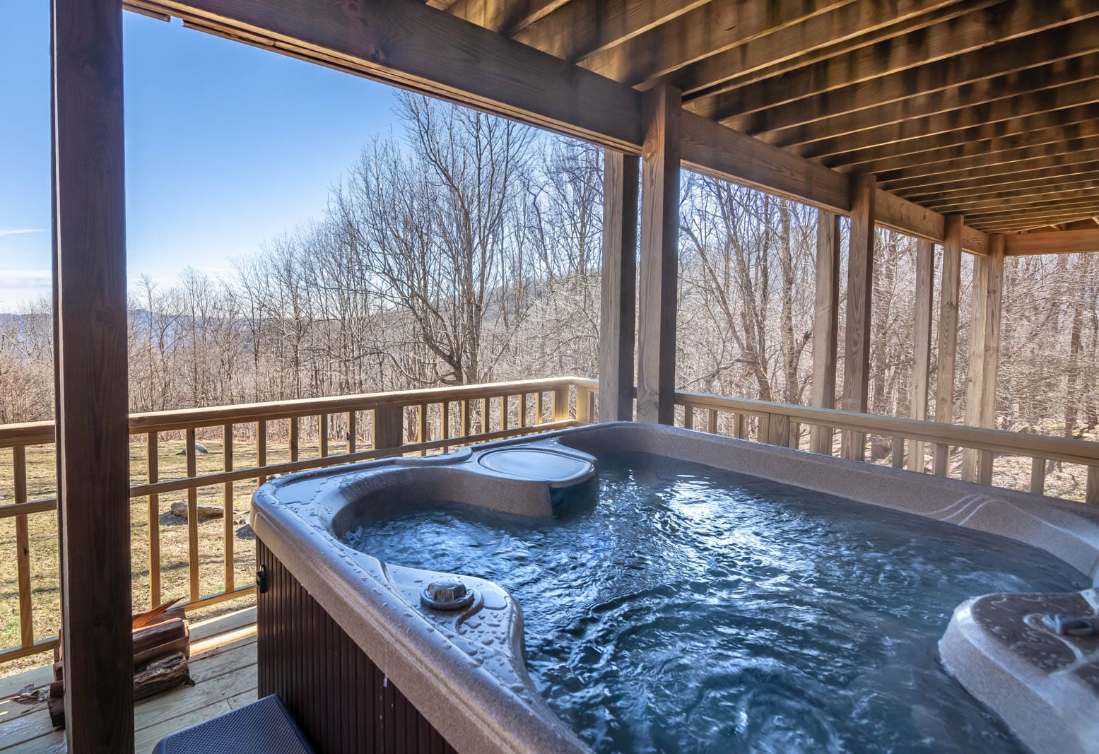 Hot Tub on lower deck overlooks yard and mountain views