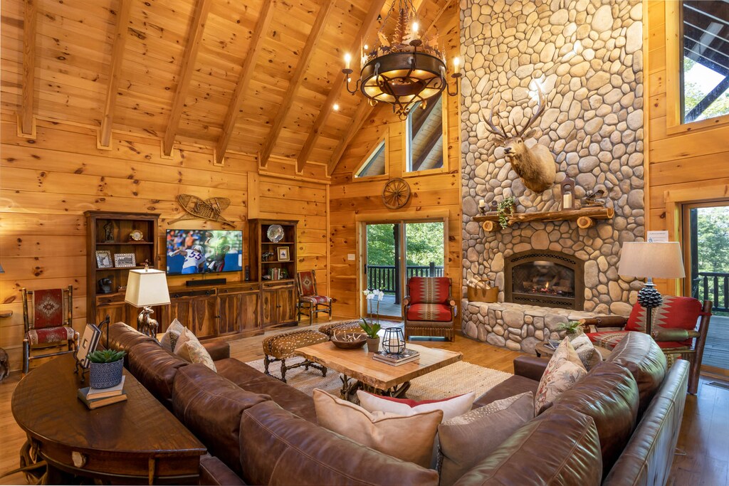 Great Room on Main Level with River Rock Fireplace and HDTV