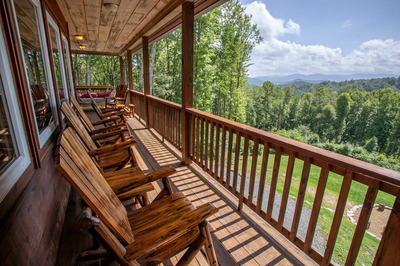 Classic Rocking Chairs on the Covered Deck Overlooking Long-Range Mountain Views