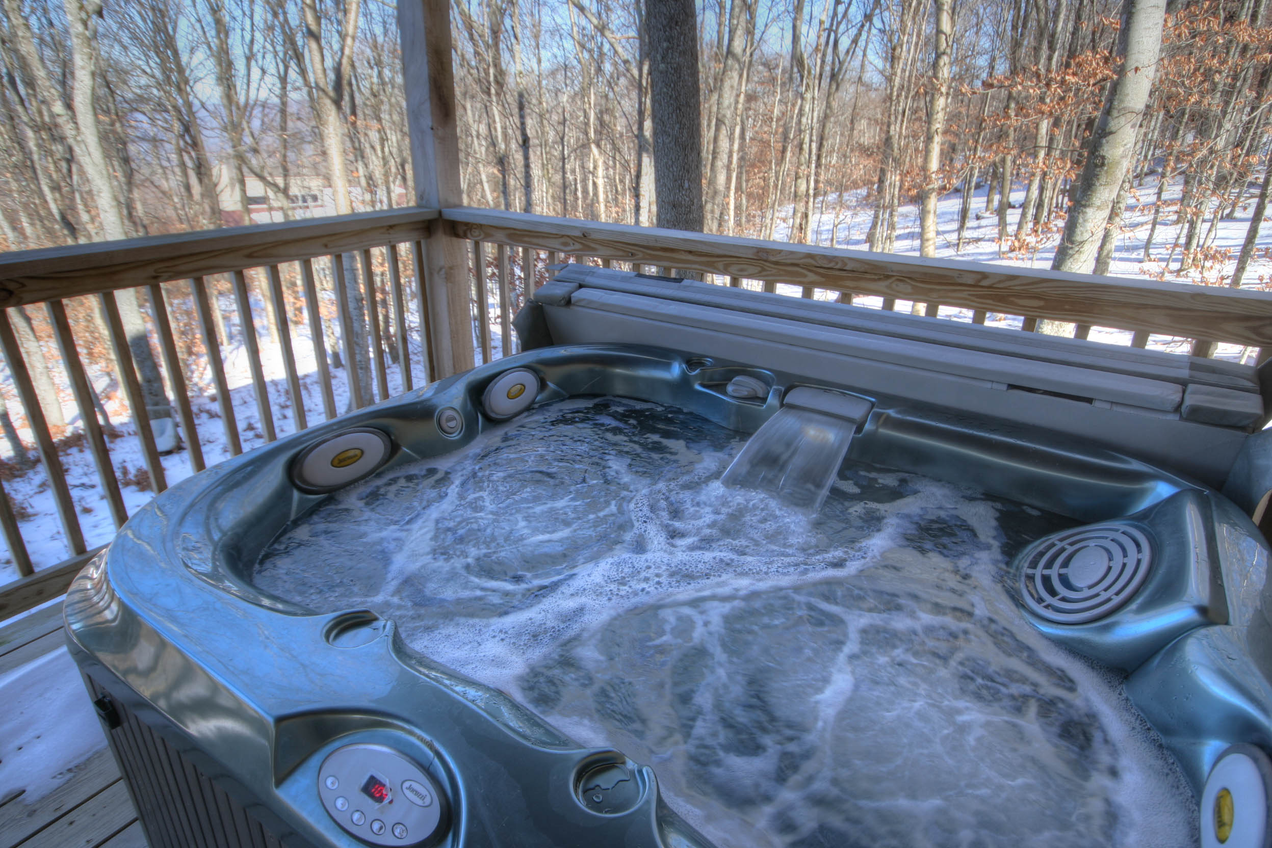 Soak in the Hot Tub in any season on the covered porch!