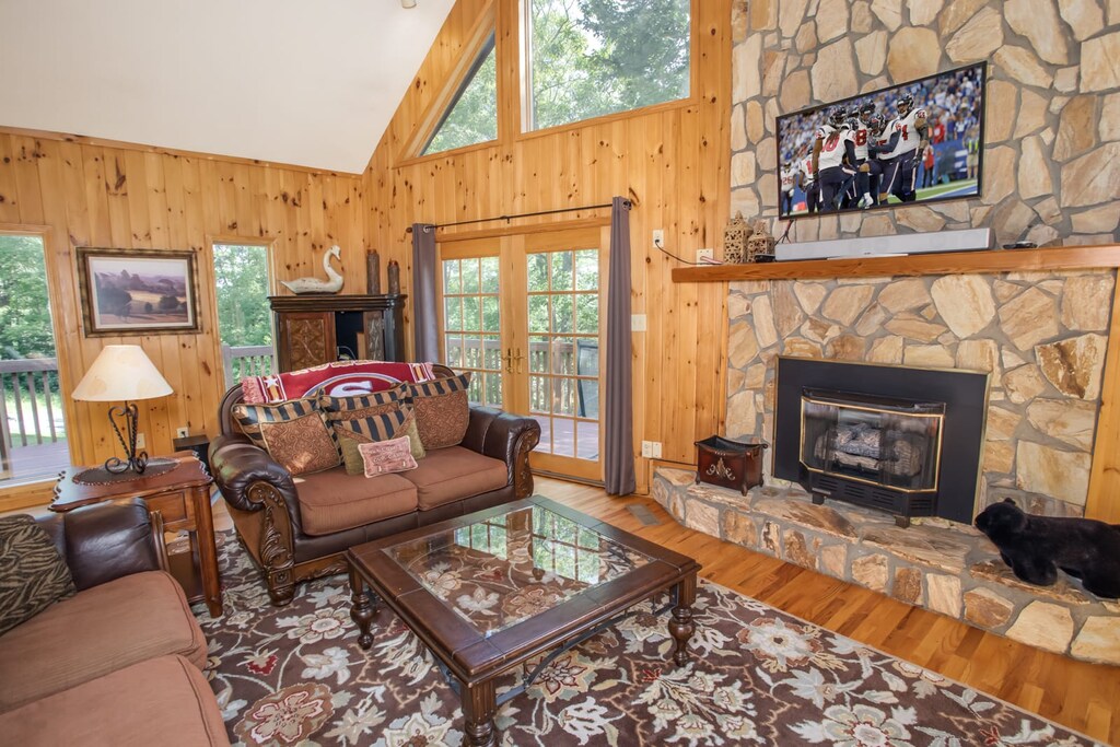 Living Area with Stone Fireplace and HDTV