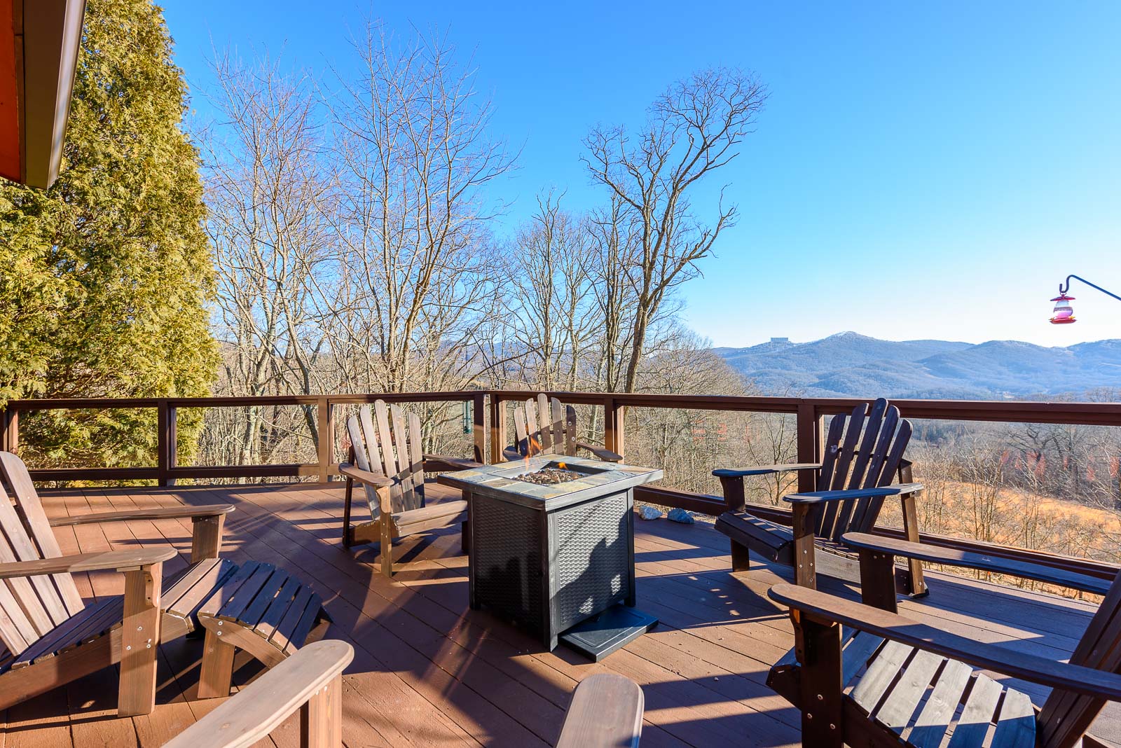 Deck with Fire Table and Adirondack Chairs overlooking Long Range Views