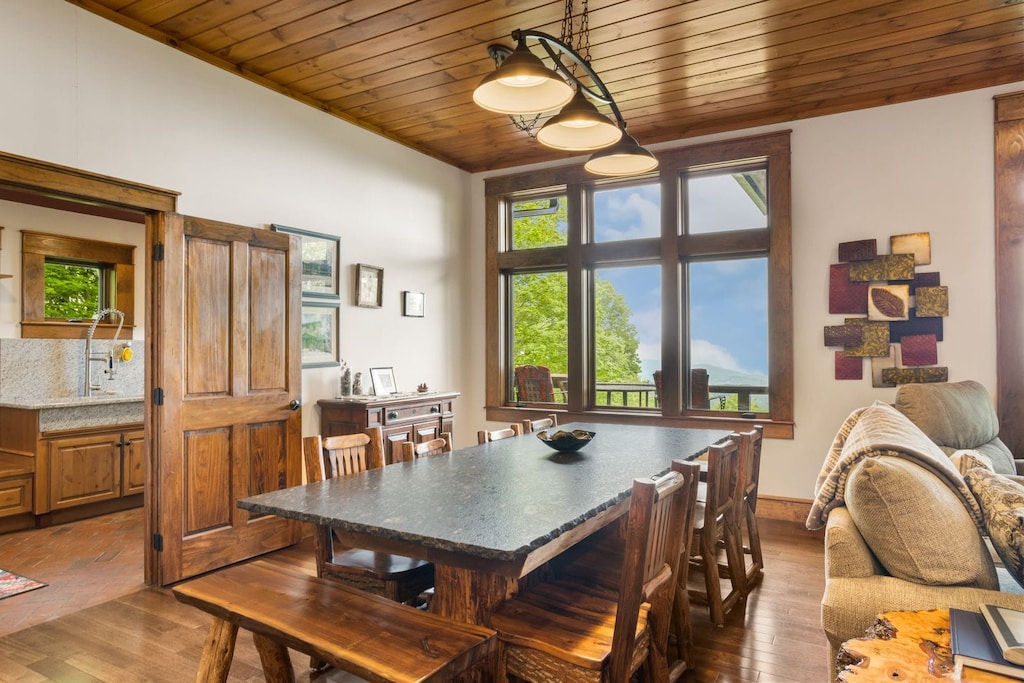 Custom Banquet-style Leathered Granite Dining Table with Log Seating