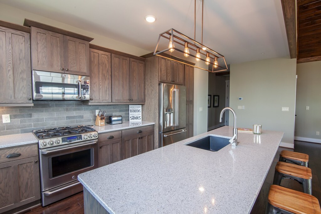 Kitchen with Quartz Counters, Custom Cabinetry, Gas Cooktop