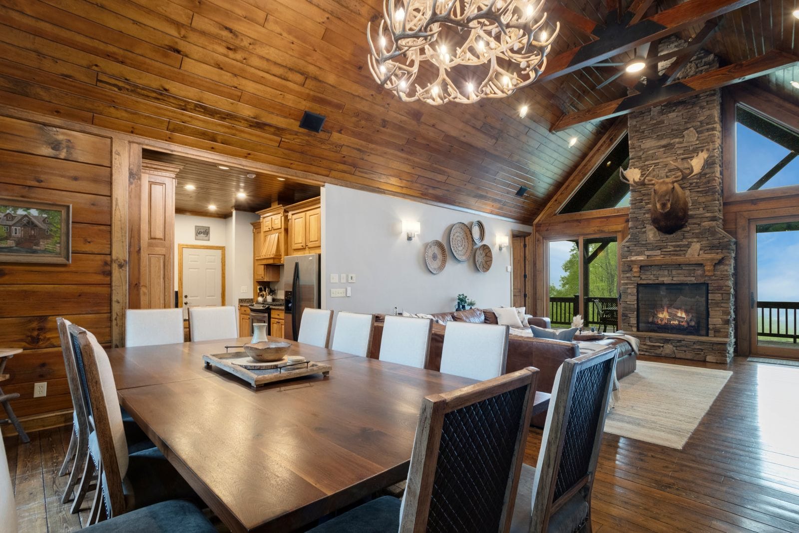 Open Concept Dining and Great Room with Wall of Glass Framing Mountain Views