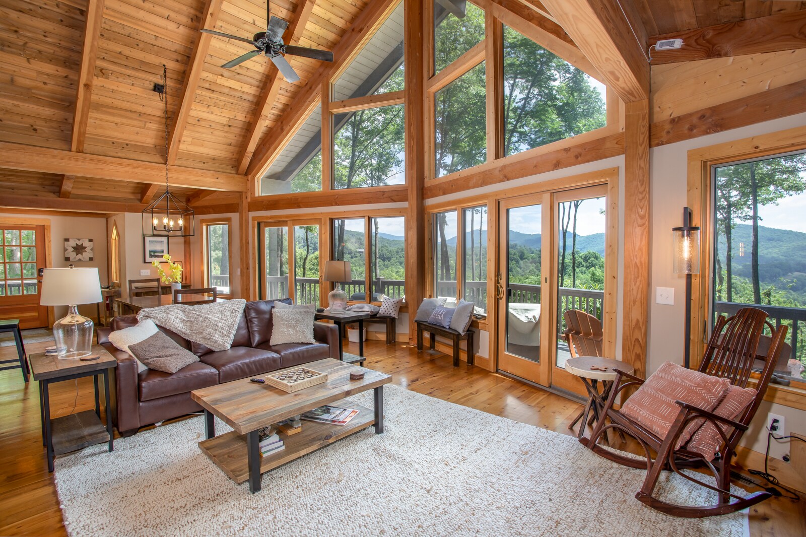 Huge Great Room with Soaring Vaulted Tongue-in-Groove Ceilings, Exposed Beams, and Wood Floors