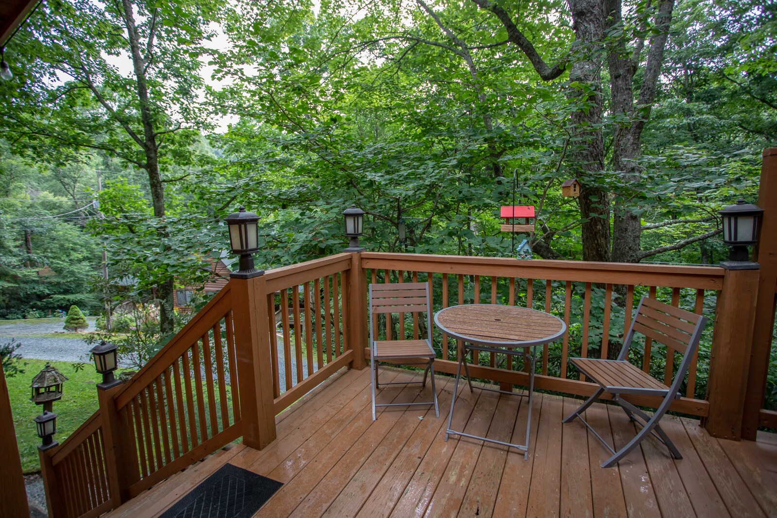 Outdoor Patio with Bistro Table and Steps to Back Yard