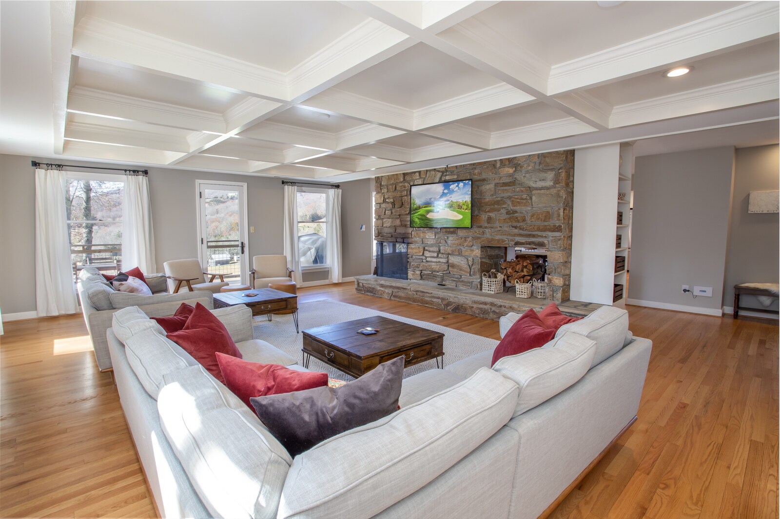 Welcome to Mountain Mojo! Great Room with Coffered Ceiling, Huge Stone Fireplace, and HD Smart TV