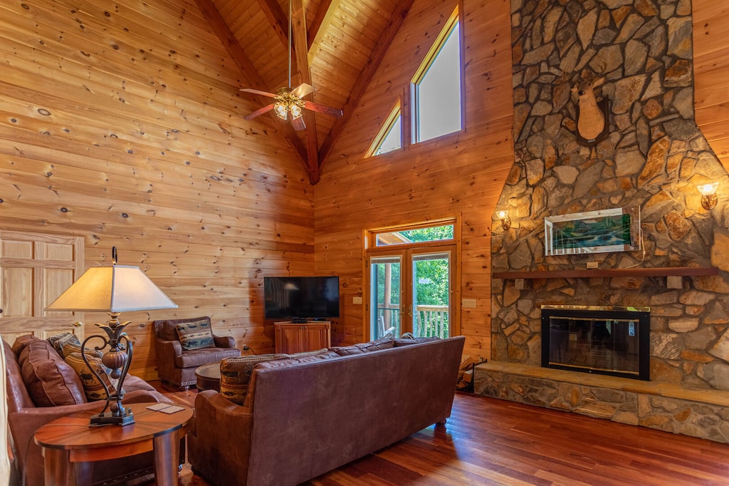 Stone Fireplace in the Great Room with Vaulted Ceiling and Warm Wood Interior