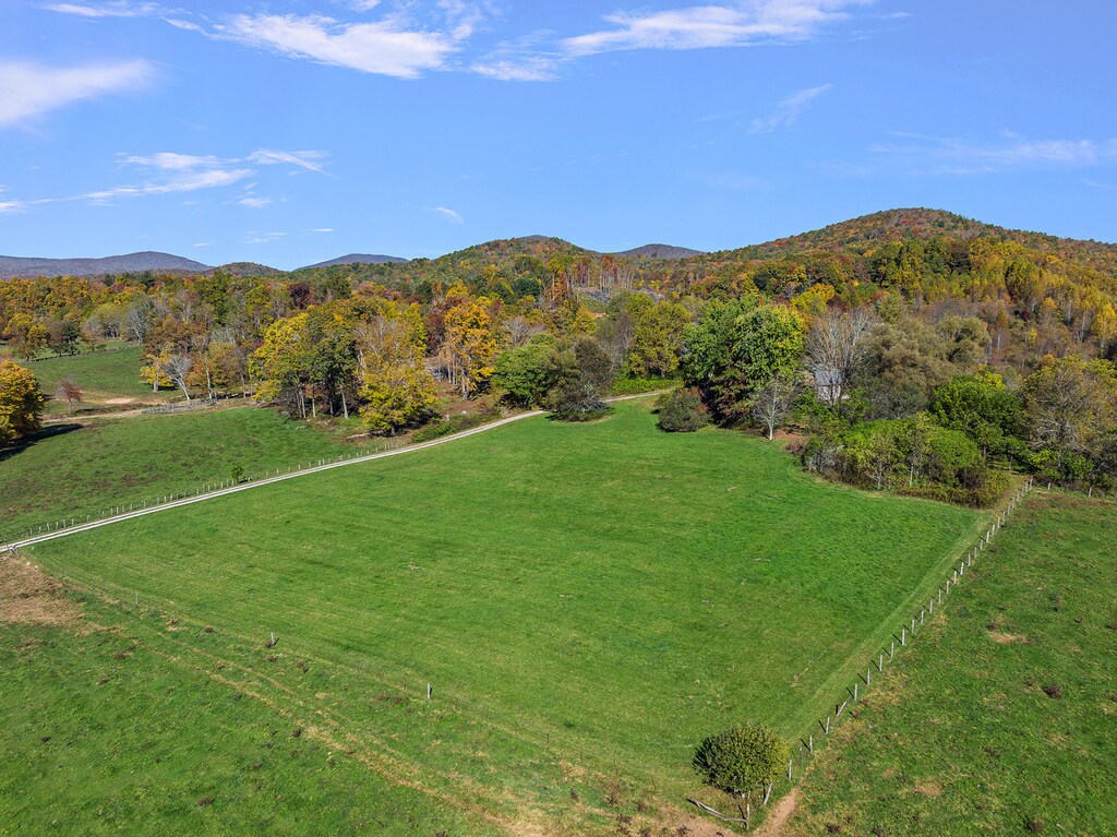 Long Driveway on Left Leads to the Top of the Knoll where Big Hill Cabin Sits Tucked into the Trees