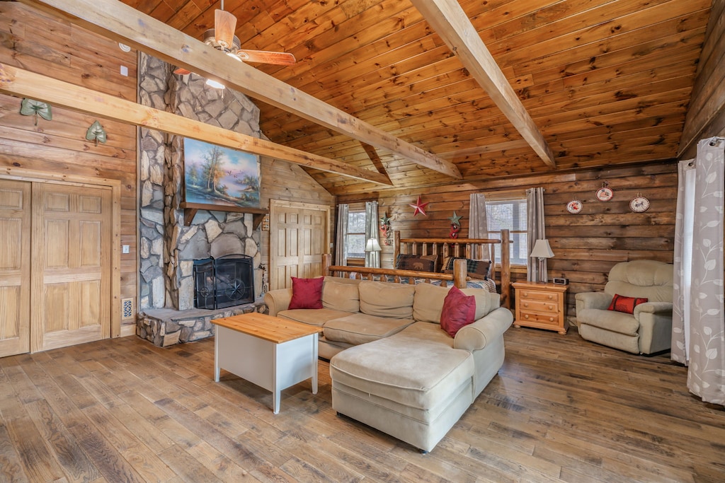 Cozy up in your rustic retreat with soaring wood ceilings, stone fireplace, and comfy seating perfect for mountain evenings.
