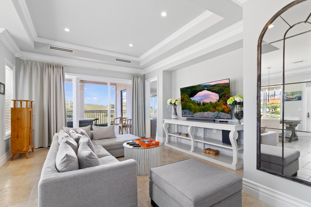 Unwind in style in our cozy living room, complete with a balcony, a comfortable couch, and a Smart TV for your entertainment.