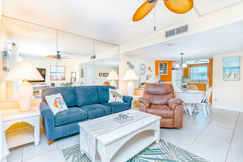 Spacious and inviting living area with cozy furniture and a coastal-inspired design.