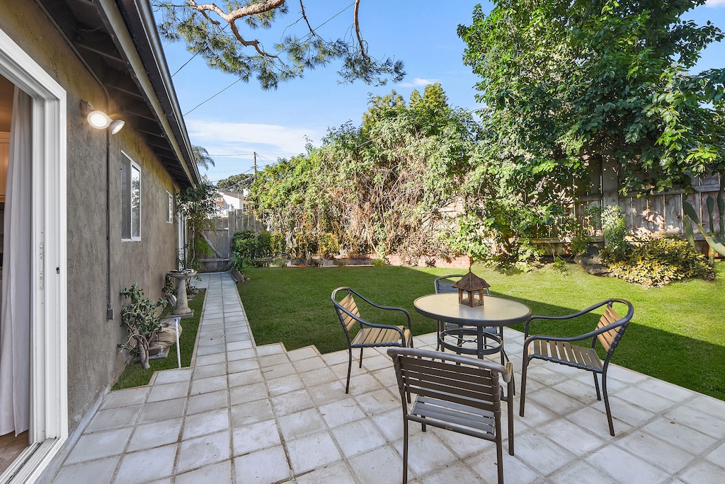 The private gated entrance includes artificial turf, adding a low-maintenance outdoor space to enjoy.
