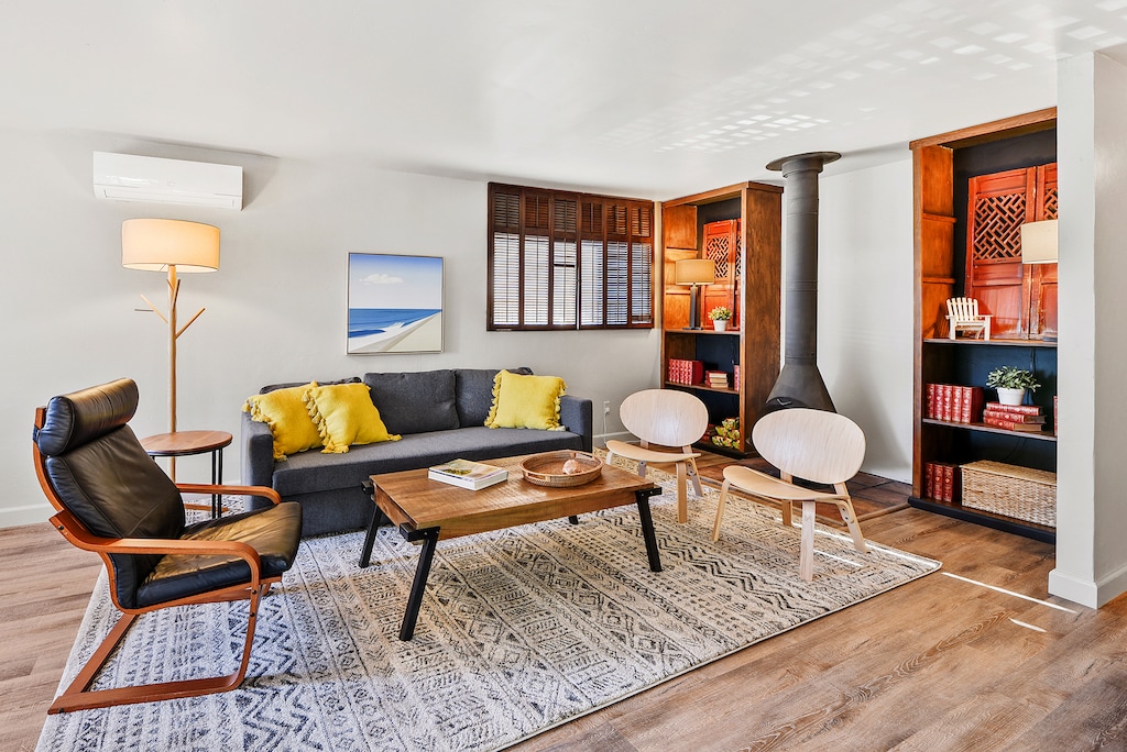 The living room features a real fireplace, creating a cozy atmosphere for relaxing or entertaining.