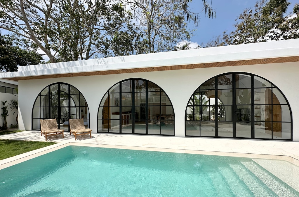 Luxurious two-bedroom villa with a large swimming pool and two daybeds