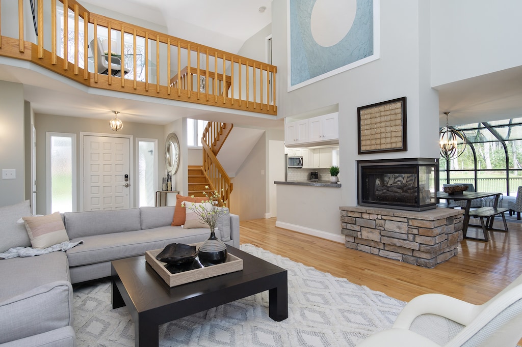 Relax in style with a peninsula gas fireplace and a couch that everyone adores!