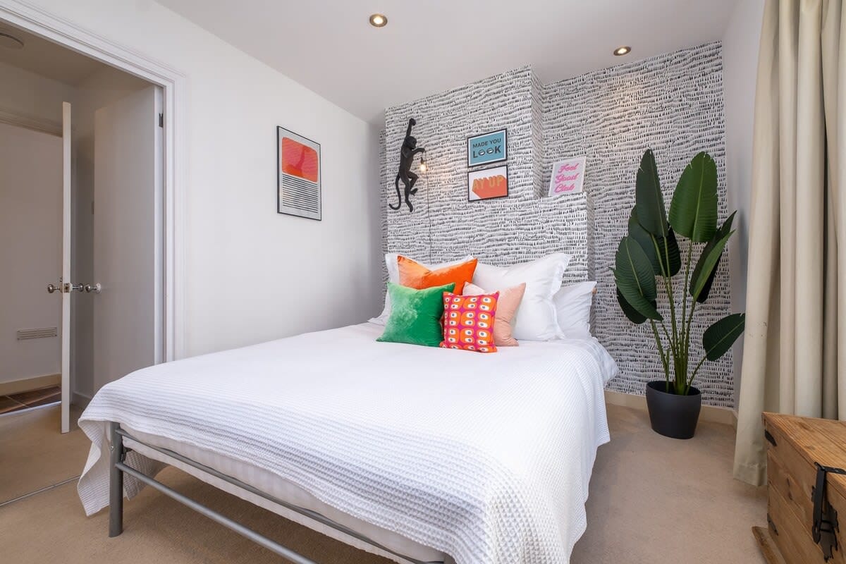 Bright and beautiful, yet calm and relaxing, the main bedroom with double bed and quirky monkey light!
