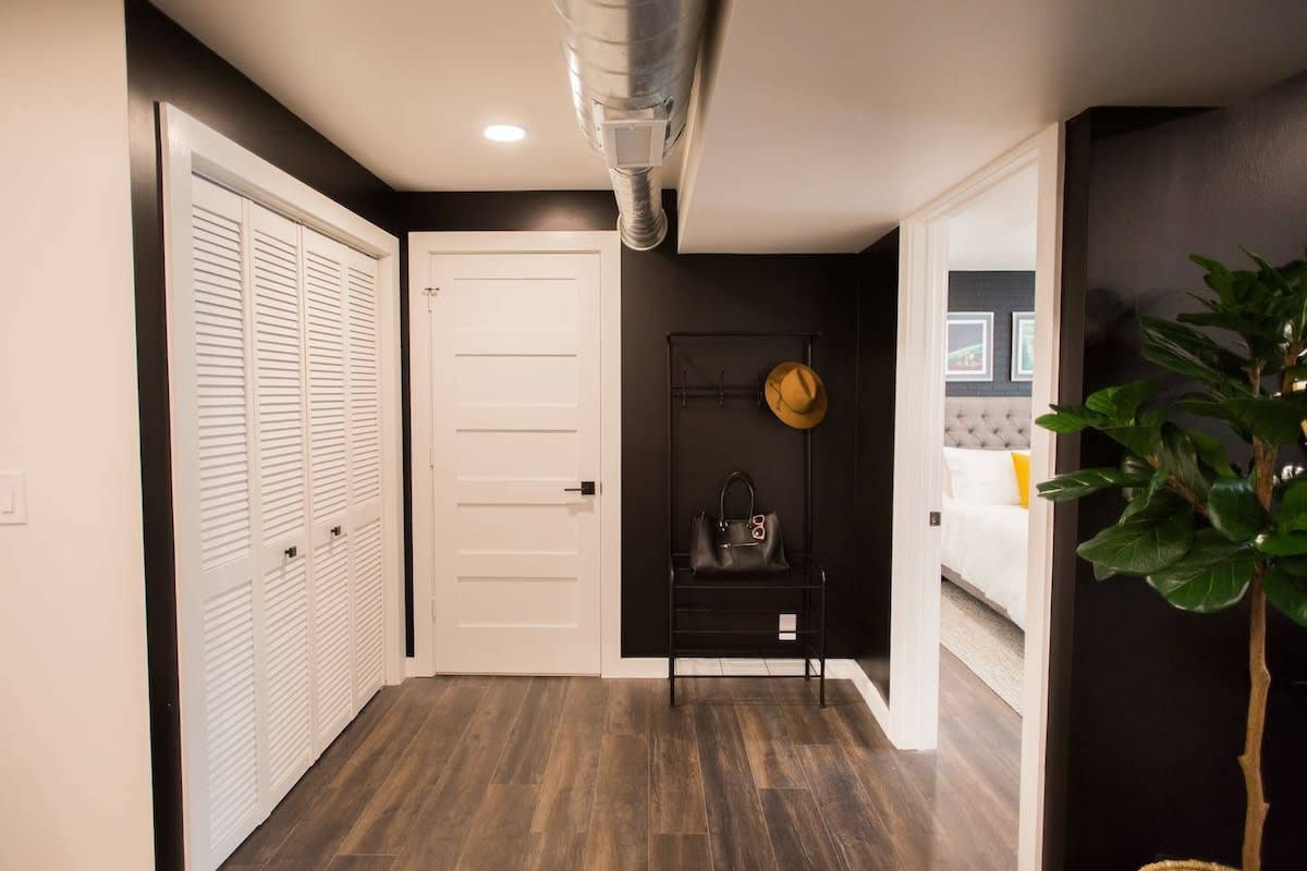 This hall area right outside the bedroom has a hall tree to hang your purses/coats. The double door closet to the left is the laundry closet.