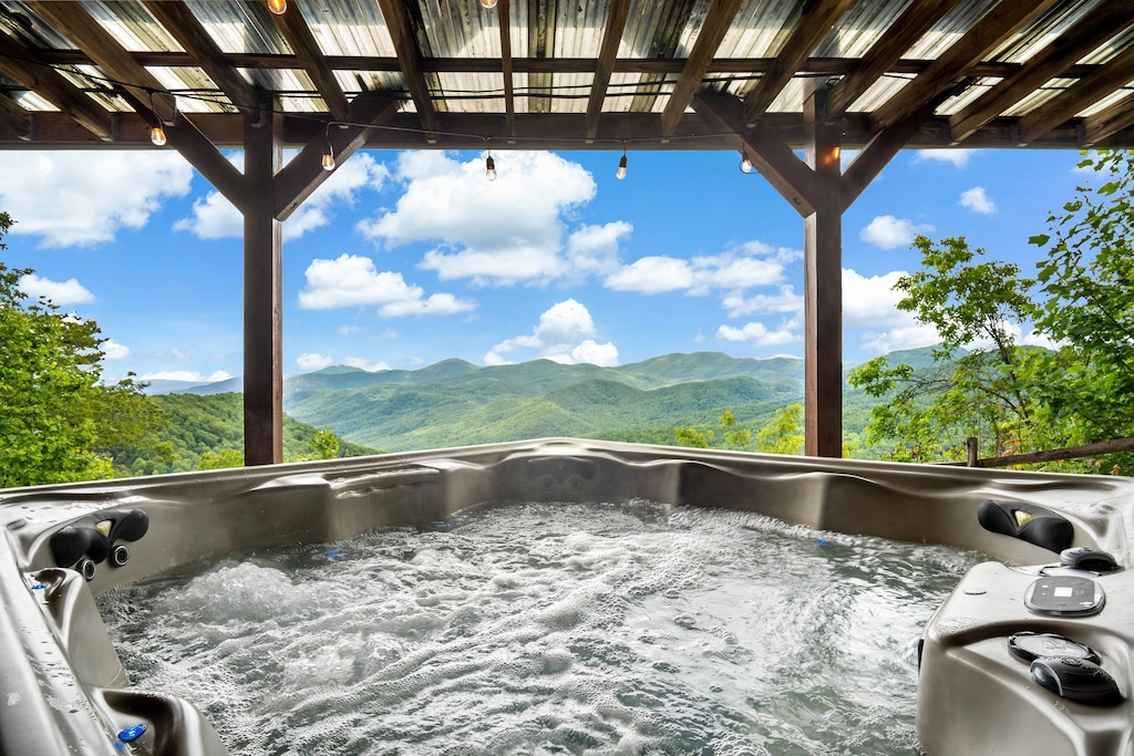 Enjoy long-range views from the hot tub on the lower level, under bistro-style lighting.