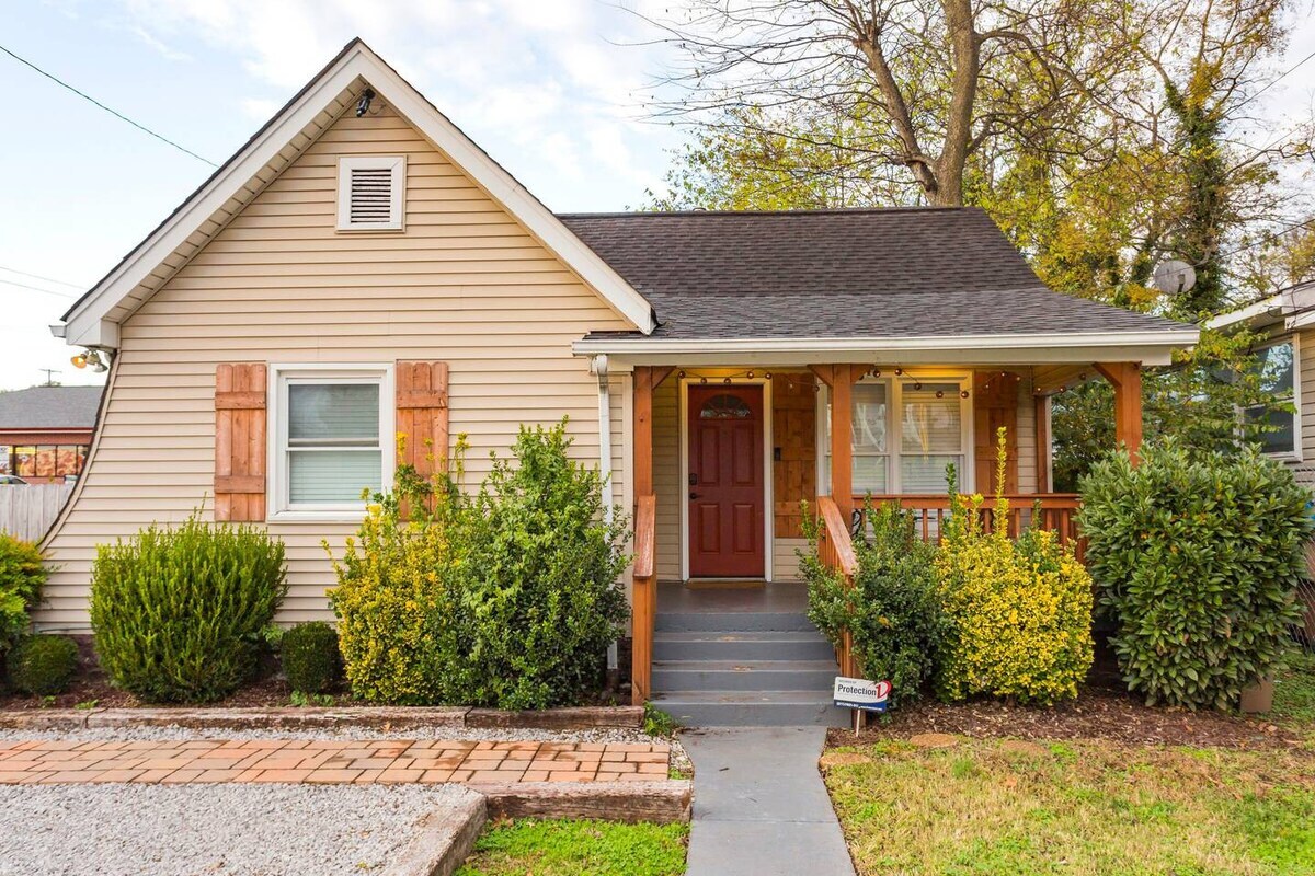 Front of house with gravel parking pad - can park 2 cars comfortably.