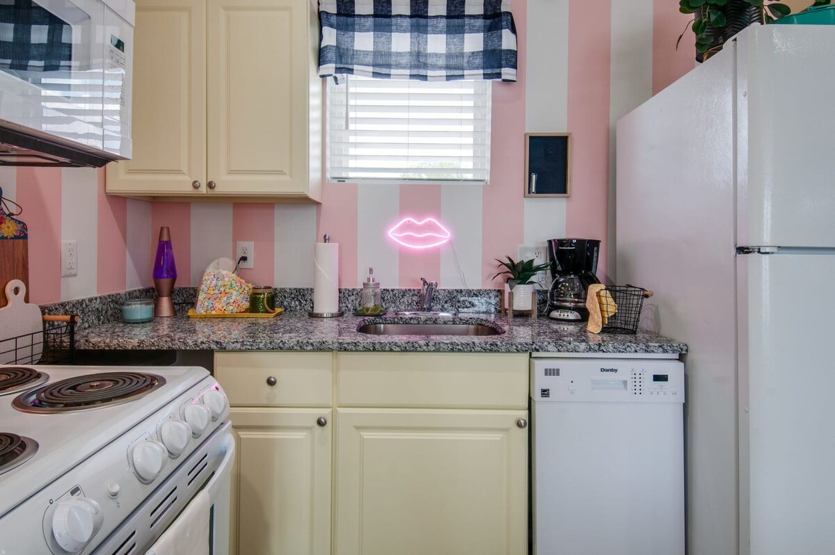 Experience unforgettable fun in our playful Nashville kitchen with candy-striped walls and vibrant decor, perfect for bachelorette parties or family getaways. Create lasting memories—book with Misfit Homes!