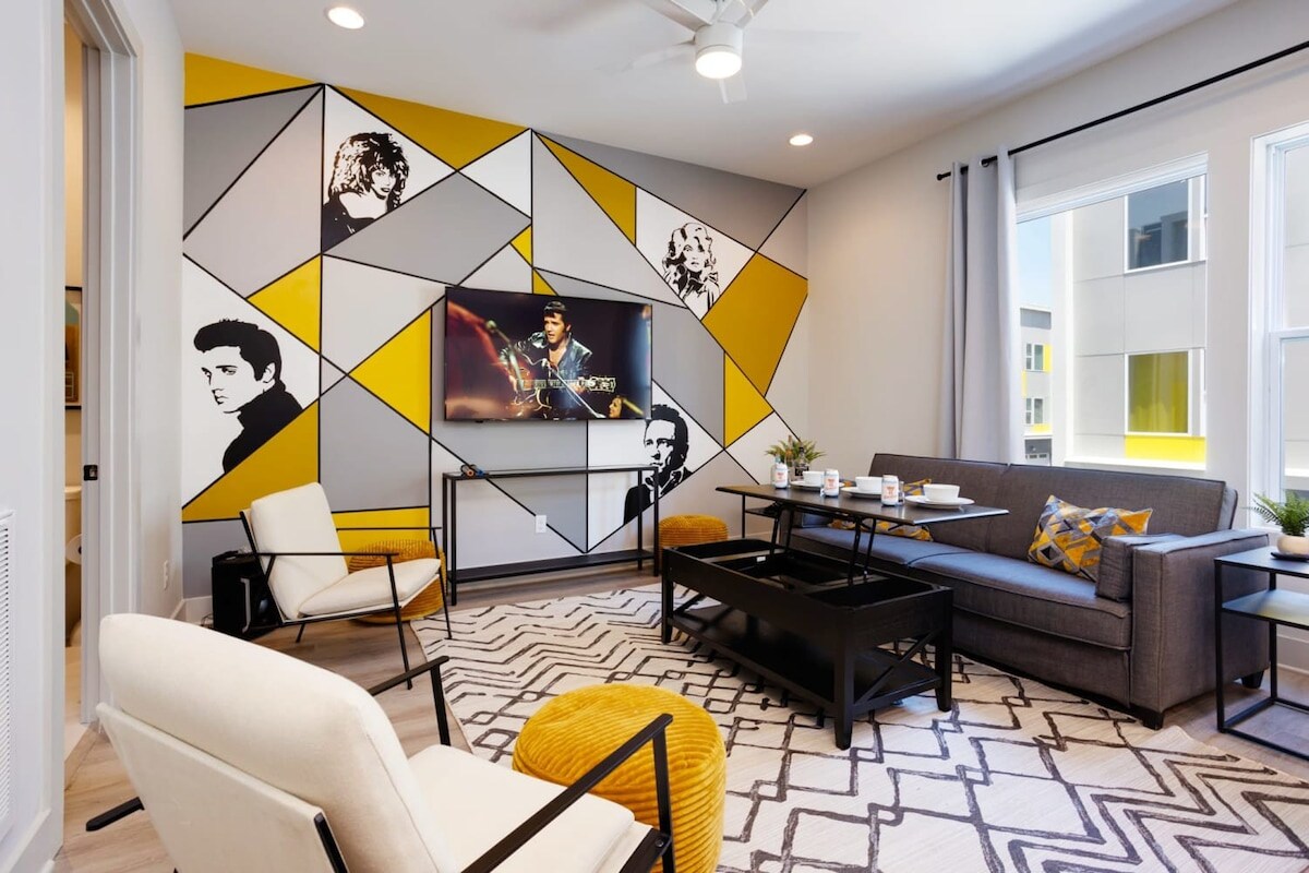 Step into the Music City's vibe with Misfit Homes' Nashville luxury vacation rental! Perfect for your next bachelorette bash or family getaway, lounge in this chic living space adorned with iconic music murals, plush seating, and bright, inviting windows. Feel the rhythm of the city in this stylish retreat—book your unforgettable Nashville vacation now with Misfit Homes! 🎸🌟