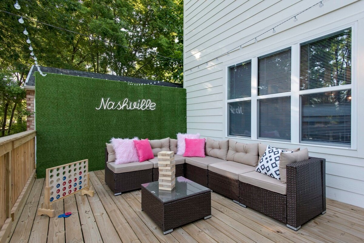 Enjoy your morning brew or pre-party drinks in true Nashville style on this luxury vacation rental's charming deck, decked out with a plush sectional sofa, trendy privacy hedge, and engaging games like Jenga and Connect Four. Under the glow of string lights, unwind or celebrate amidst bespoke touches like the illuminated 'Nashville' sign and lush greenery. Tailor-made for any group getaway, from bachelorette parties to family vacations in Music City.

Ready for your luxe retreat? Book with Misfit Homes and lock in your dates!