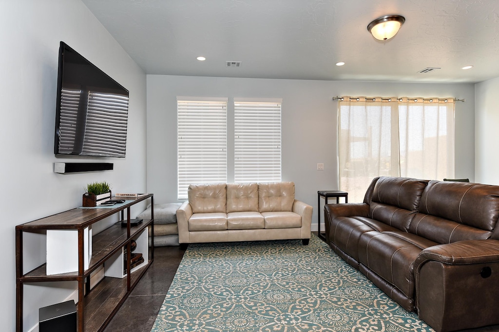 The Living Room is located adjacent to the Dining Room and is the perfect place to relax and watch your favorite movie or TV program.