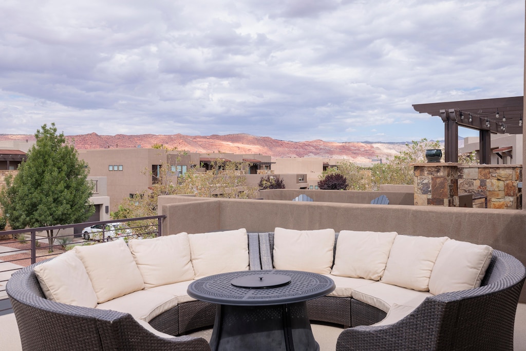 Stay warm next to the firepit and relax while watching the sunset over the red mountains.