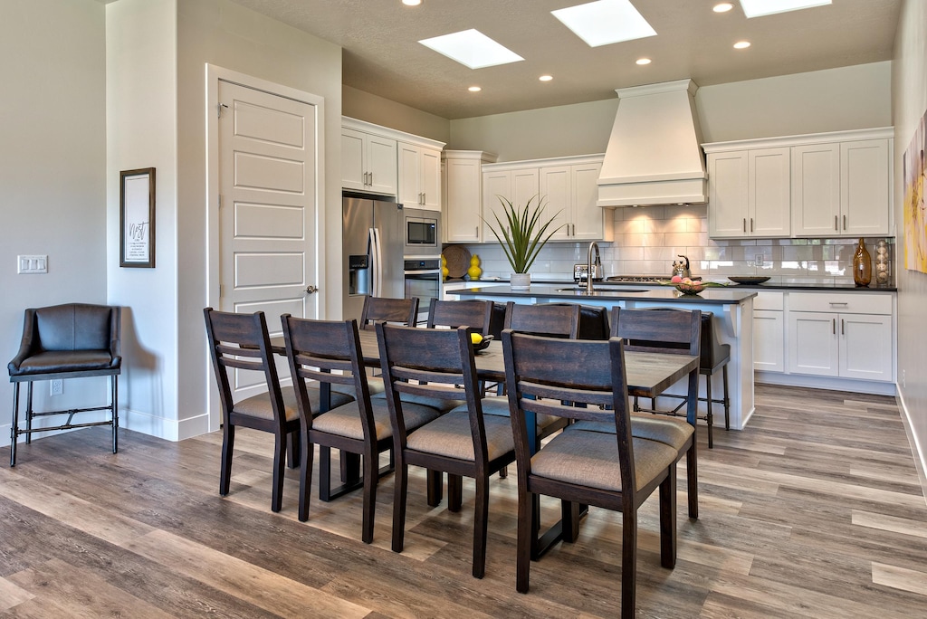 With an open and spacious floor plan, the Dining Room and Kitchen can accommodate meal preparations for groups large or small.