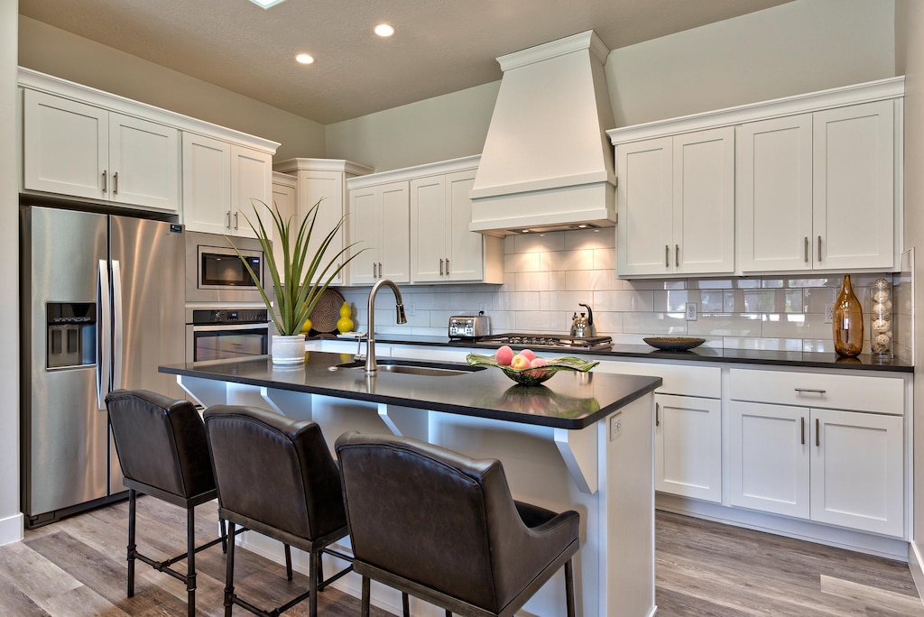The Kitchen is fully stocked with all the dishes, cookware, baking pans, and cutlery you will need for meal preparations and includes stainless steel appliances and granite counter tops.