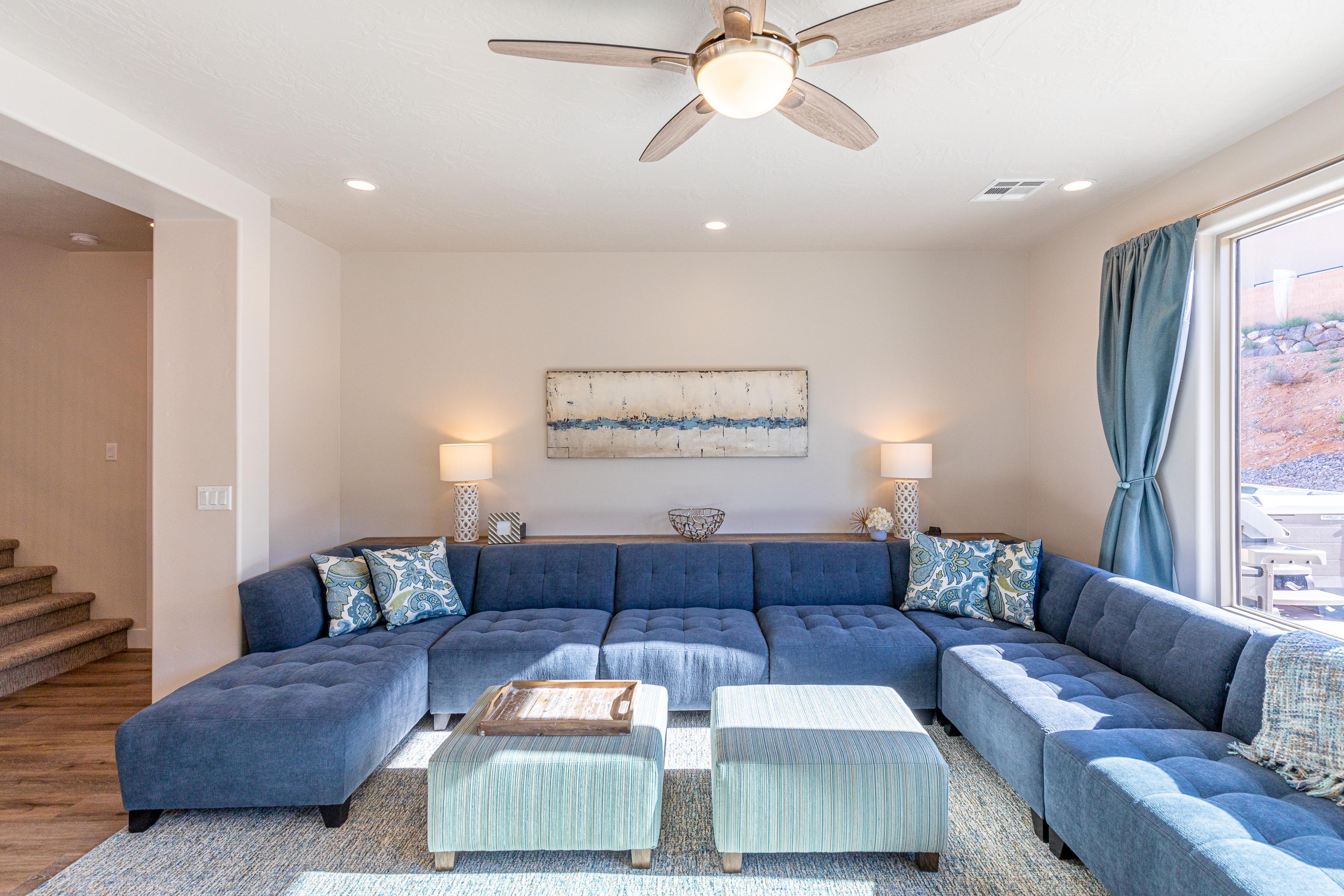 The living room is designed as an open floor plan and is a great gathering place for meals, games, or watching TV during your stay. 