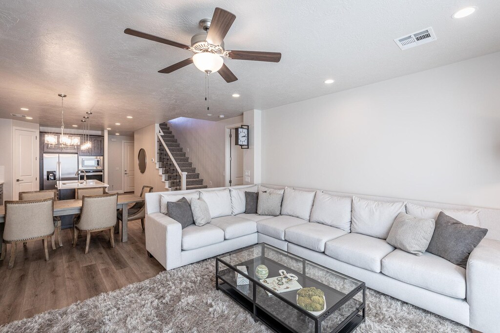 The living room is designed as an open floor plan and is a great gathering place for meals, games, or watching TV during your stay. 